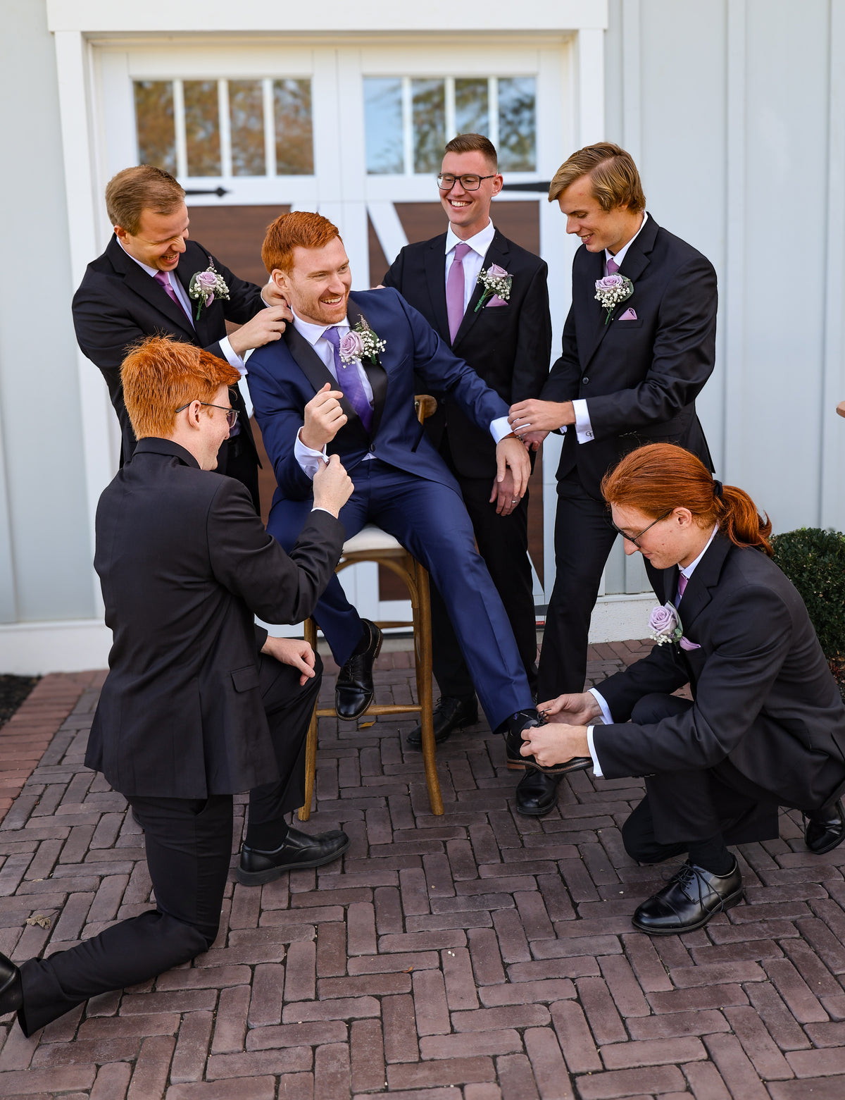 Jarrett getting ready with help from his groomsmen.