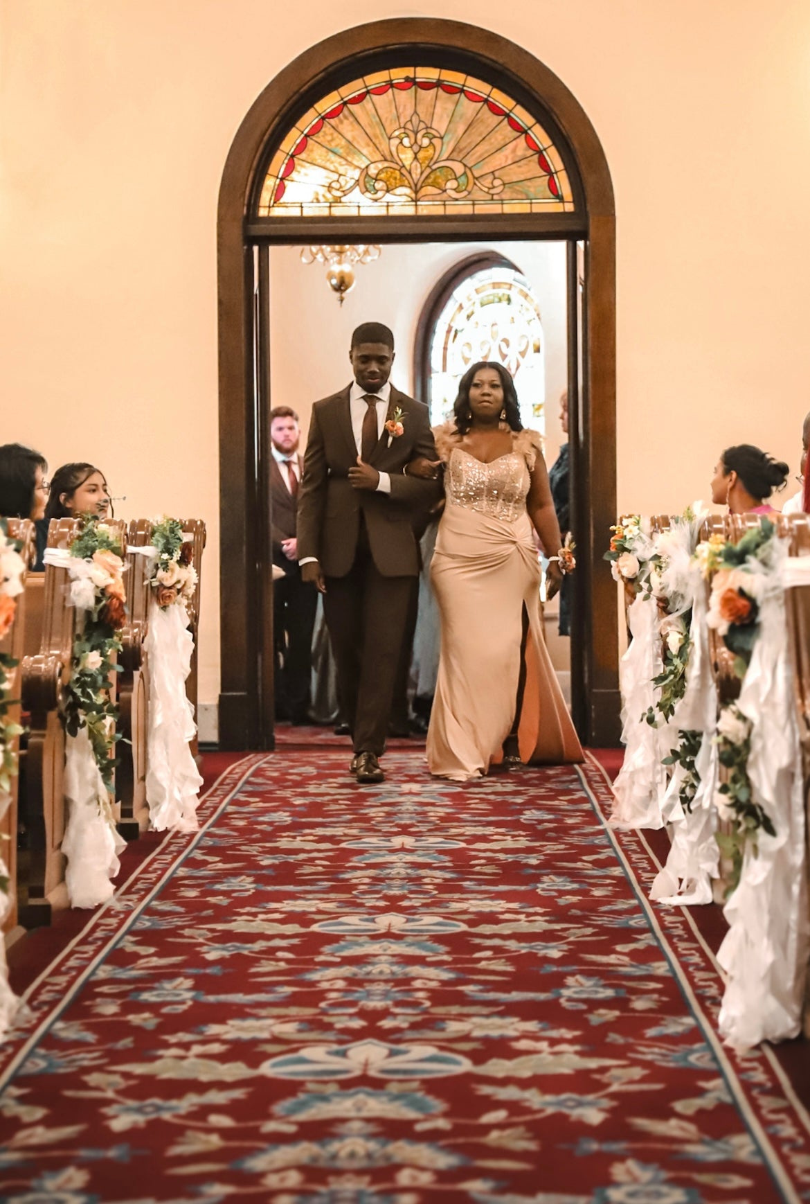 Dontavious walking down the church aisle with his mother.