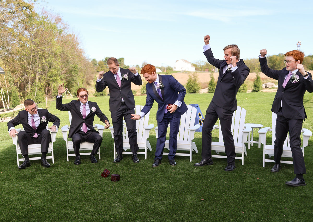Jarrett and his groomsmen sharing a playful moment.