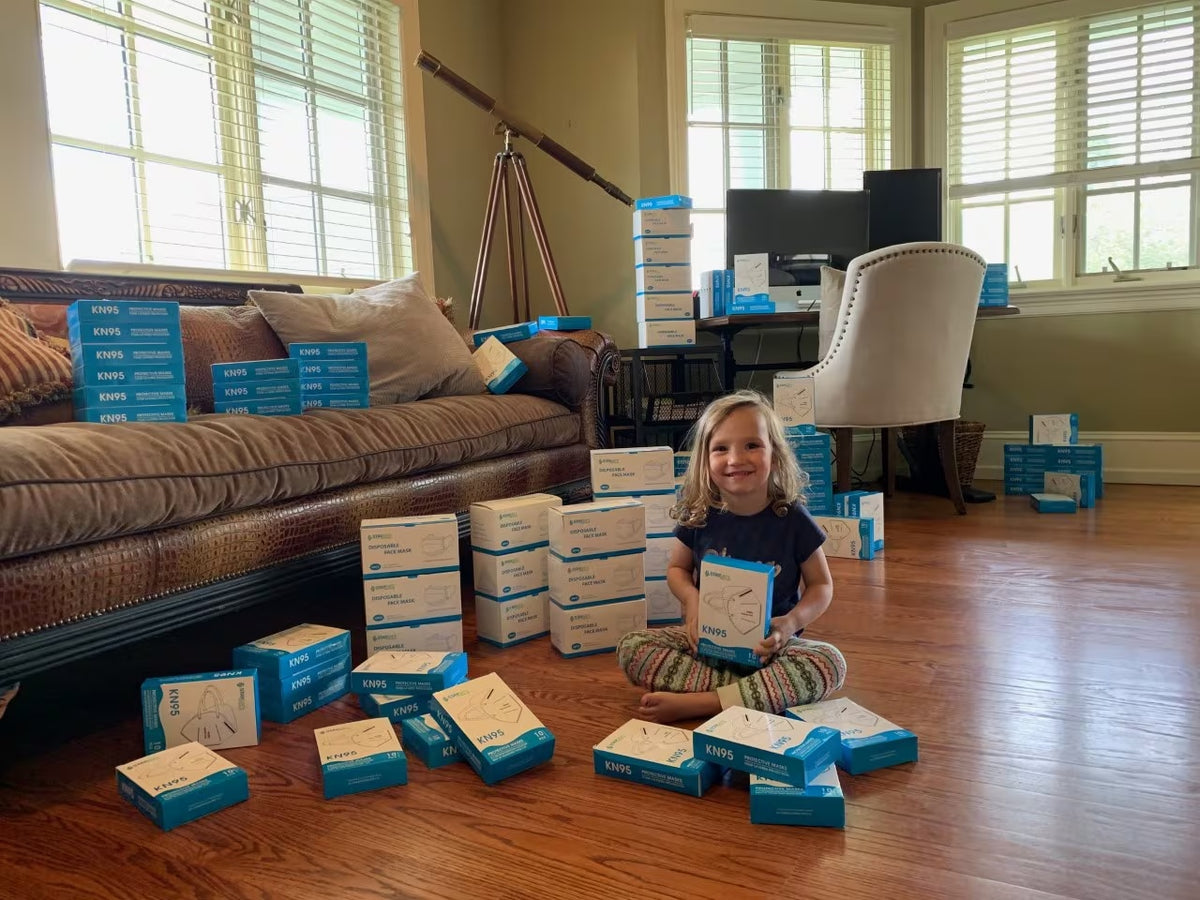 Mia helps organize masks for donation to local nursing homes.