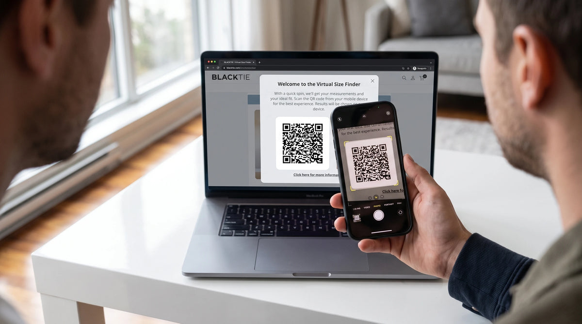 Phone scanning a QR code on a laptop to open the suit size finder.